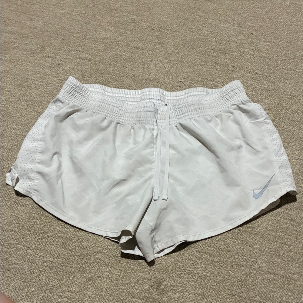 Nike Women's White Athletic Running Shorts with Light Blue Swoosh